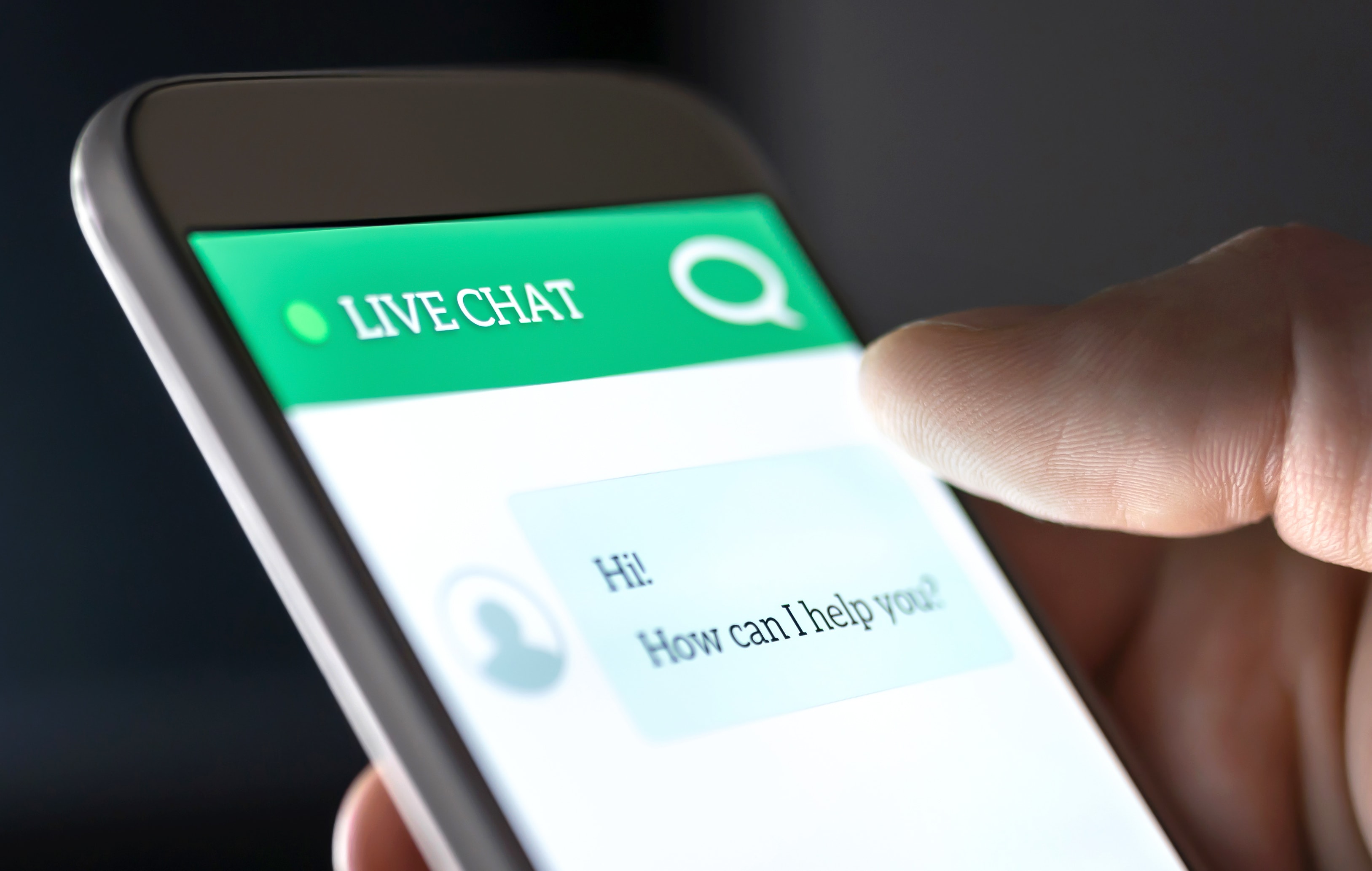 person using live chat feature on smartphone