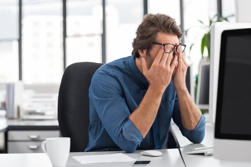 worker stressed at desk