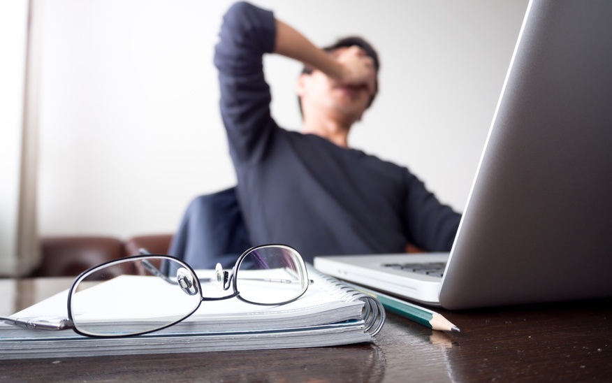 person struggling at laptop