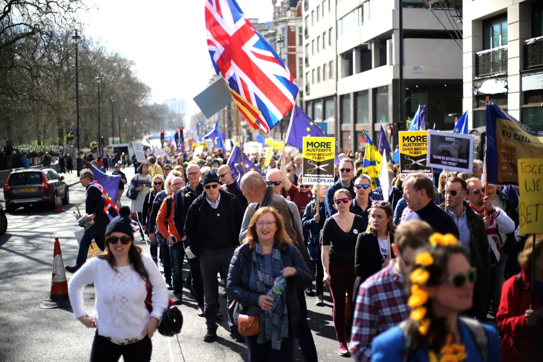people walking in protest in streets of Great Britain