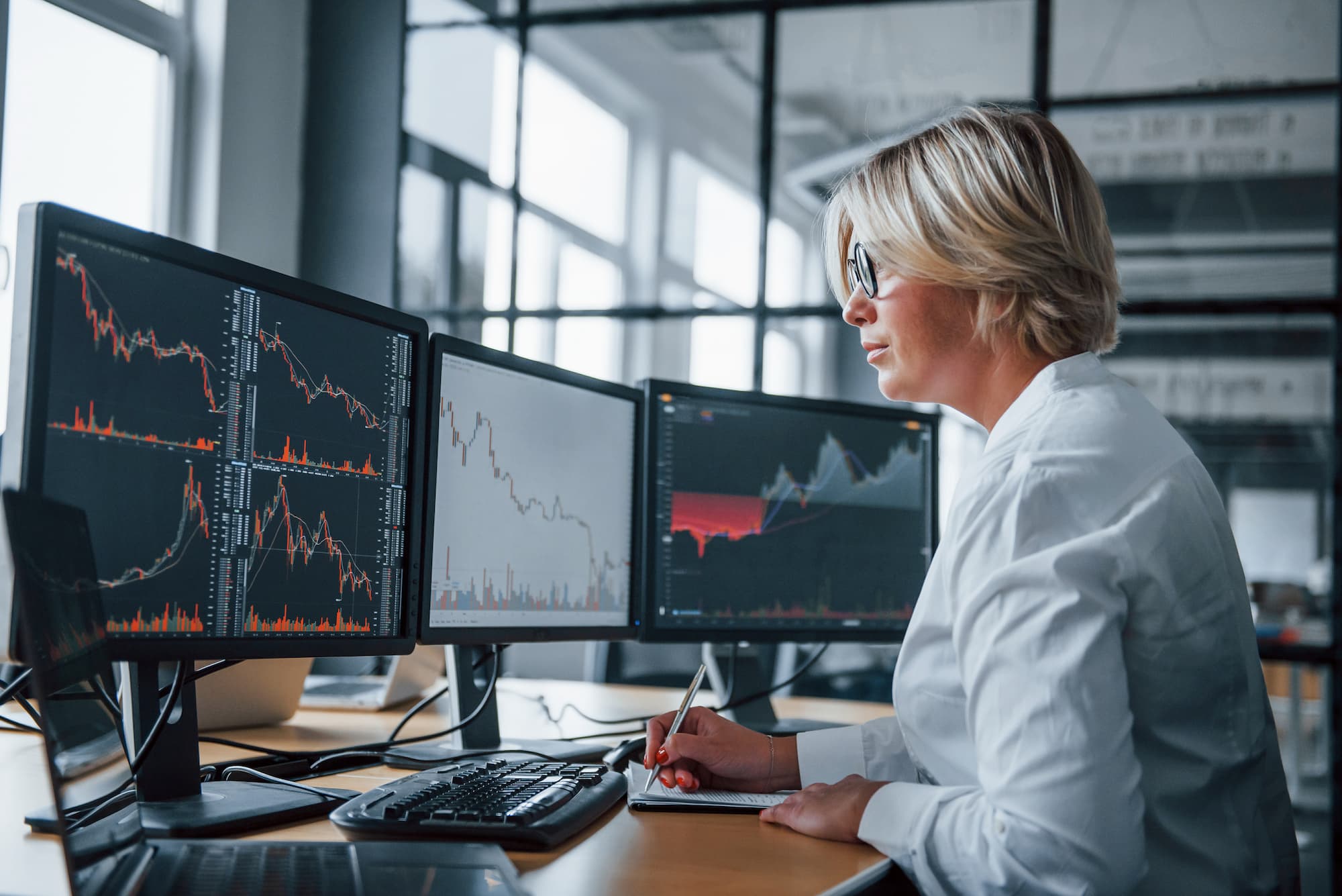 woman looking at stocks and charts and inflation risks